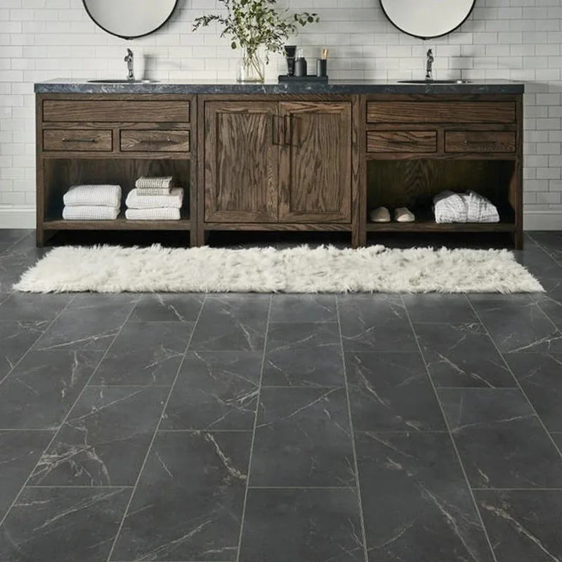 Charcoal grey marble-effect LVT tile flooring in a modern bathroom.