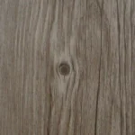 Close-up of a light wood plank with a natural knot