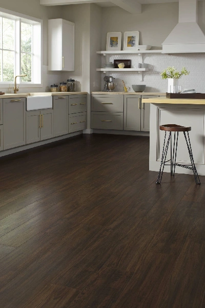 Deep brown wide plank laminate flooring.