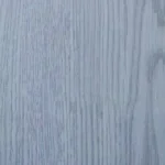 Detailed texture of light grey wood grain flooring