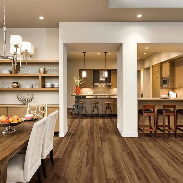 Dark laminate plank flooring in bright dinning Area