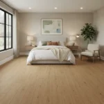 Light golden wood-look LVT plank flooring in a modern bedroom