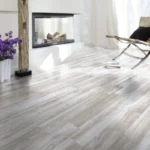 Light grey wood flooring in modern living room.
