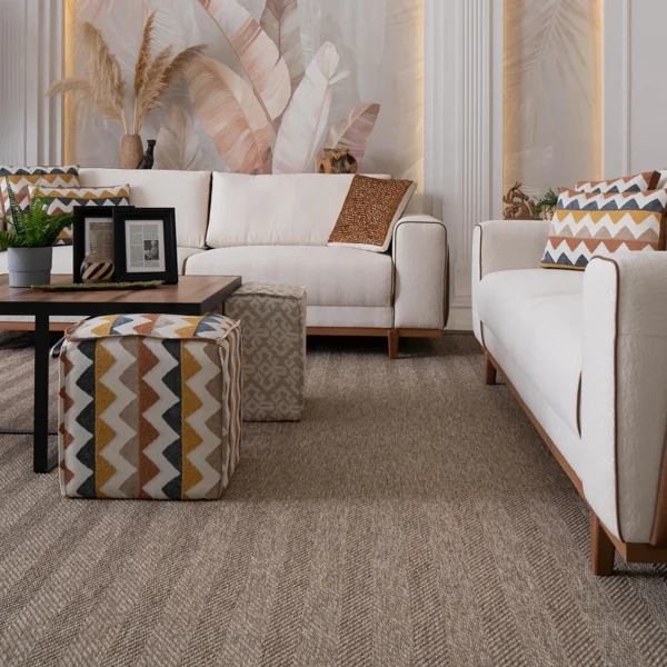 Textured chevron sisal carpet in a cozy luxury living room