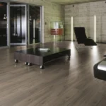 Modern dining space with grey oak wood flooring.