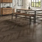 Restaurant interior with dark herringbone flooring