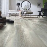Studio room with whitewashed wood flooring.