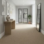 Textured beige wool carpet in a modern entryway hallway