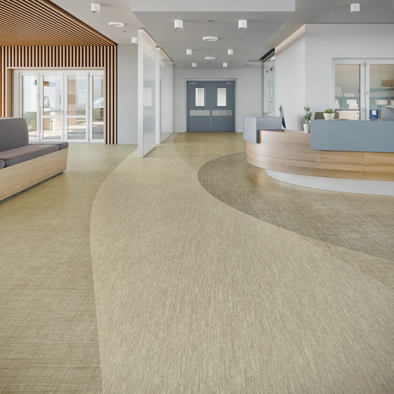 Textured, neutral-toned vinyl flooring with a curved, layered design.
