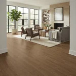 Warm medium-brown wood-look LVT plank flooring in a modern living room
