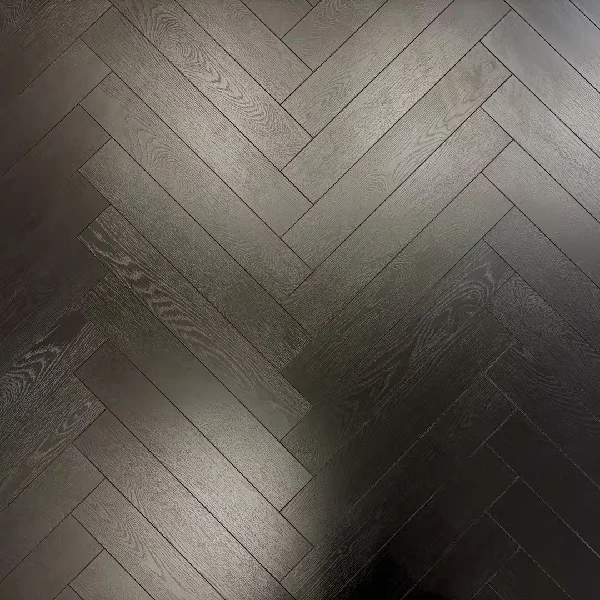 black, laminate flooring in a herringbone pattern.