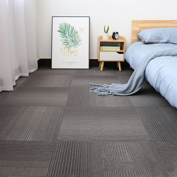 Grey striped linear carpet tiles flooring in a modern bedroom