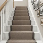 Beige carpet stair runner looking down to corner