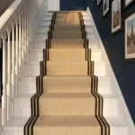 Beige stair carpet with black border stripes