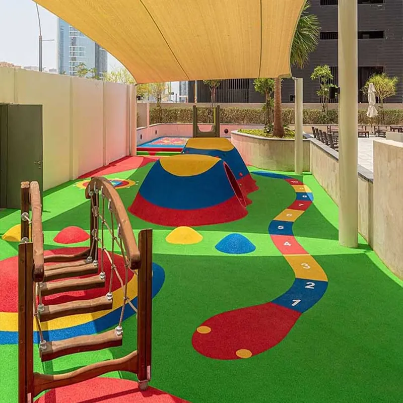 Blue EPDM playground surface with frog design