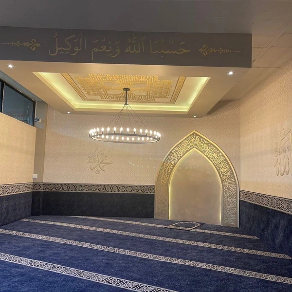 Blue mosque carpet with patterned white stripes