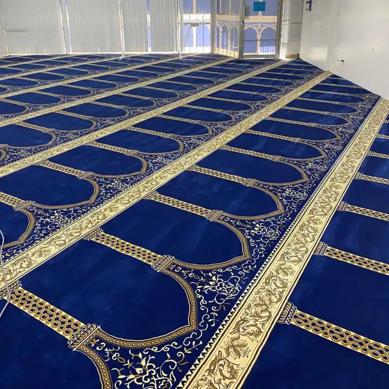 Blue mosque carpet with rows of arch designs