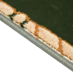 Close-up of green carpet texture with a patterned edge