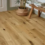 Close-up of natural oak flooring with decor.