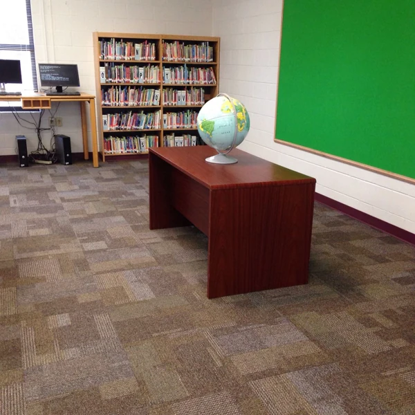 Brown patterned modular carpet tiles in a library study space