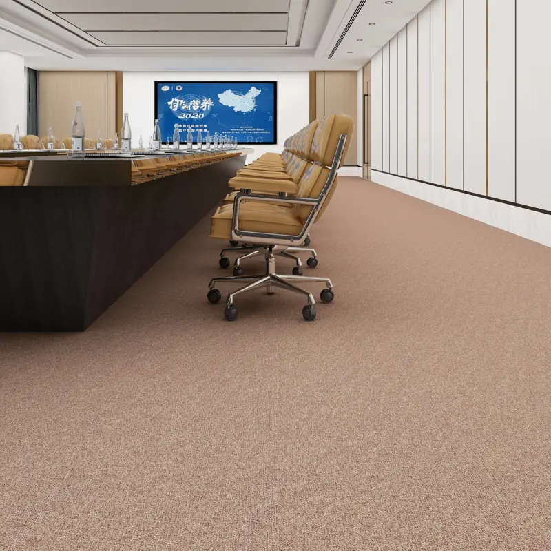 Executive office with a patterned blue-grey carpet.