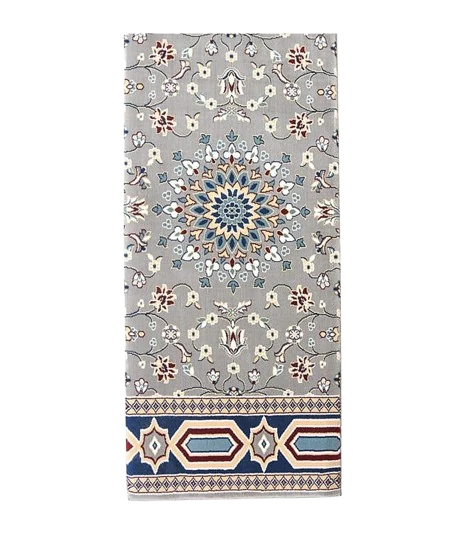 Grey floral mosque carpet with a geometric border.