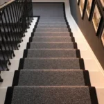 Grey textured stair carpet looking down staircase