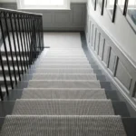 Grey textured stair runner on white steps