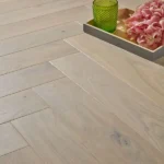 Herringbone engineered wood flooring with a flower tray