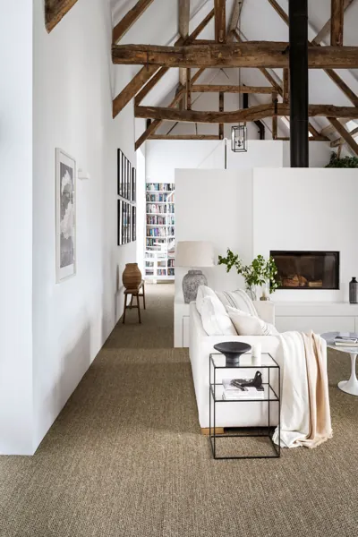 Modern living room with neutral wall to wall carpet