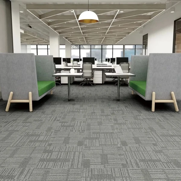 Modern office with linear grey carpet tiles.