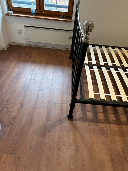 Modern wood-effect laminate flooring installed in room