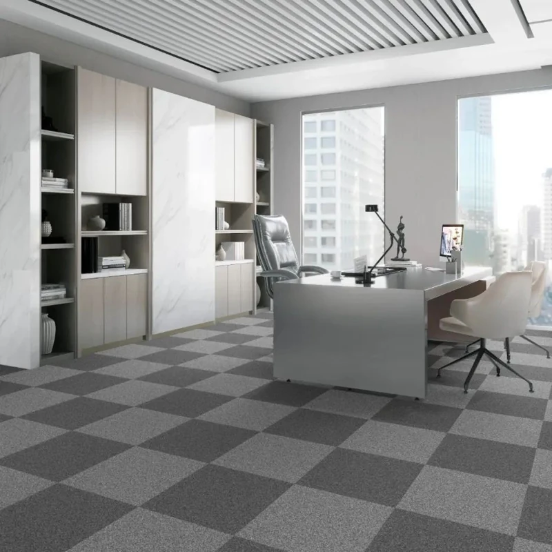Office conference room with linear grey carpet tiles.