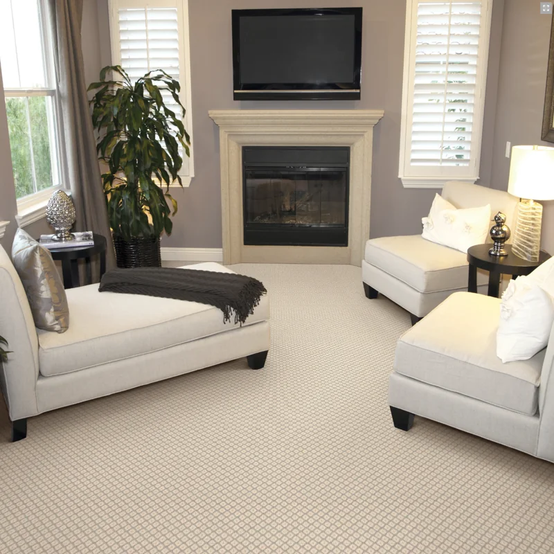 Patterned cream carpet in a cozy fireplace sitting room.