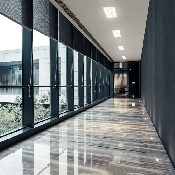 Polished stone-look flooring in a premium hotel corridor