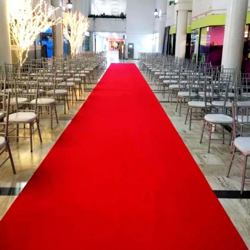 Red exhibition runner carpet in a modern lobby.