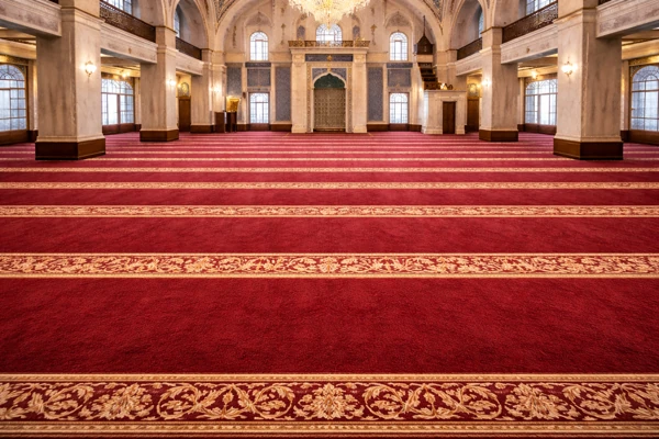 Red mosque carpet with ornate gold striped rows
