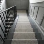 Ribbed grey stair runner looking down white steps