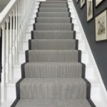 Ribbed grey stair runner on dark painted steps