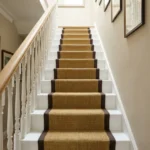 Sisal stair runner with black border on white steps