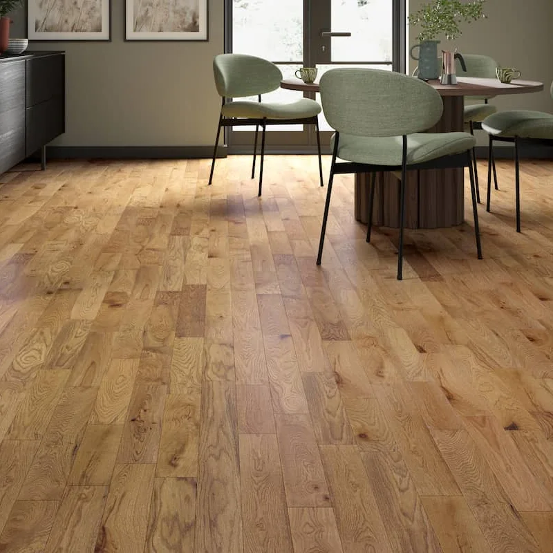 Solid wood flooring with short, light golden oak planks and natural wood grain
