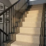 Stair runner on white steps with blue walls