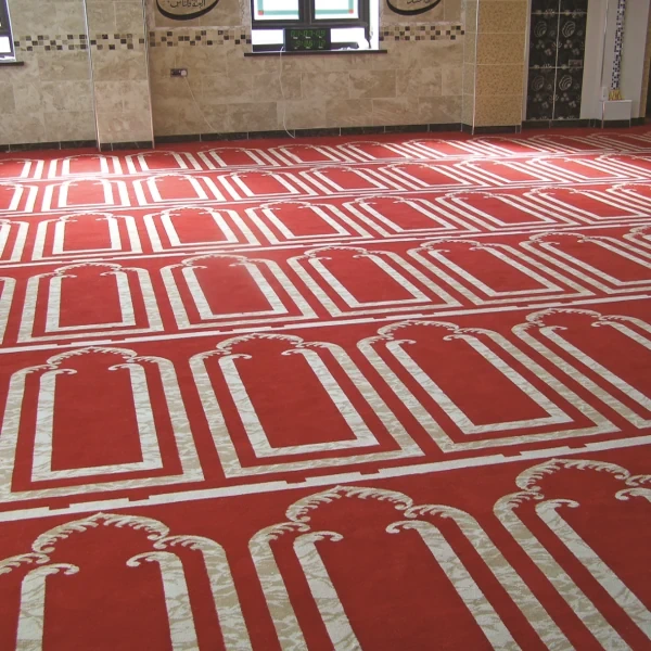 Blue mosque carpet with ornate gold and green borders