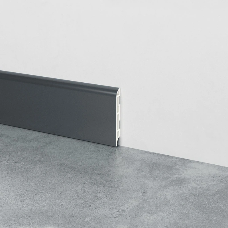 Charcoal grey PVC skirting board installed on a wall