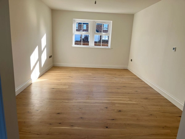 Empty room with white MDF skirting boards