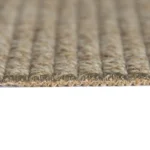 Profile view of thick looped pile rug with latex backing