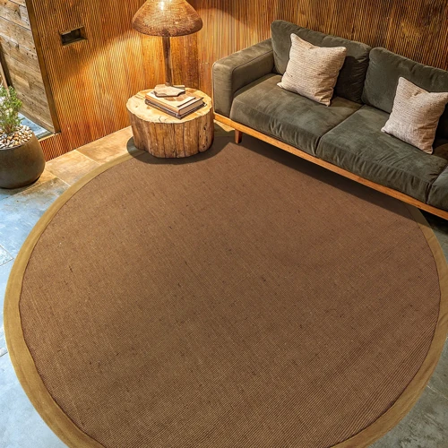Simple round carpet featuring a natural fabric look.