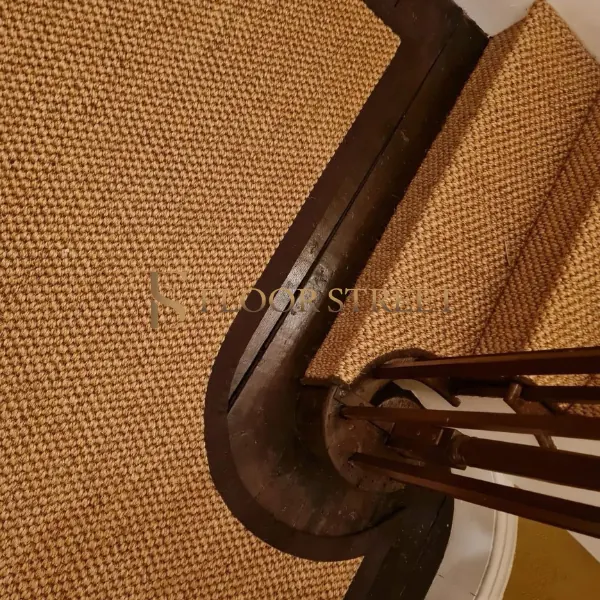 Textured sisal stair carpet with dark edges