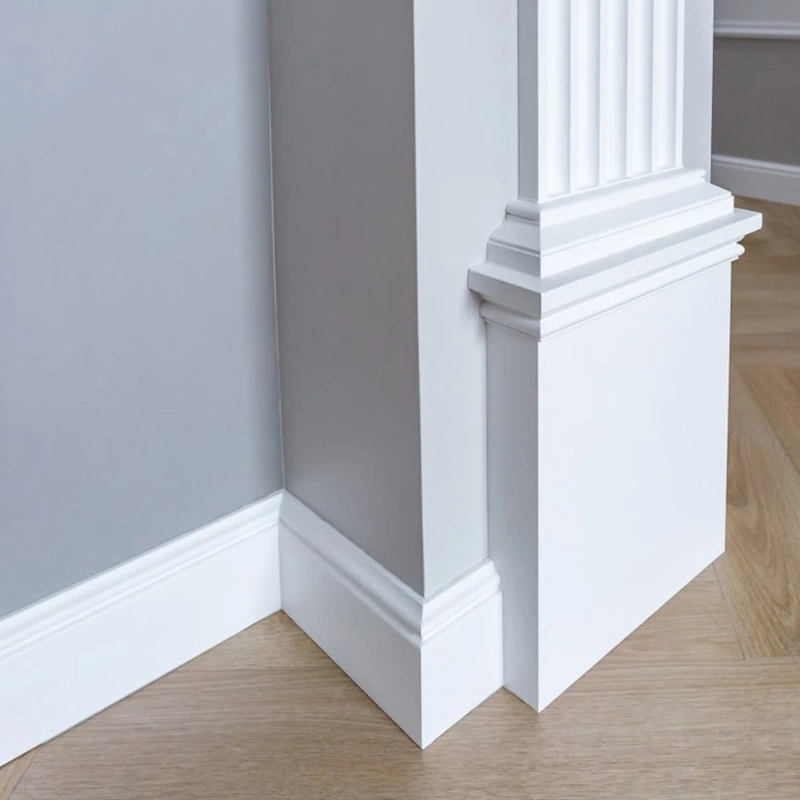 White MDF skirting board meeting a door architrave