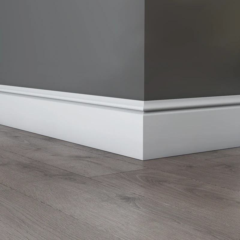 White Torus MDF skirting board on dark grey wall